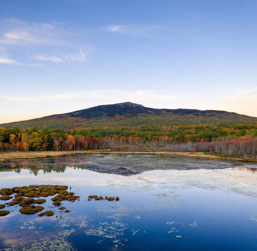 Aerial,View,Of,Mt,Monadnock,Fall,Foliage,Over,Pond,With